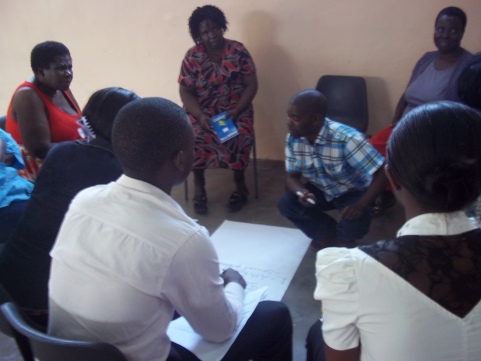 Health care workers discussing ways to improve the delivery of sexual and reproductive health services at their facilities, especially for WLHIV.