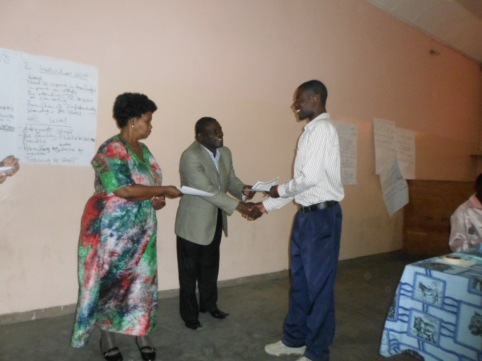 A participant receiving their certificate at the end of the day.